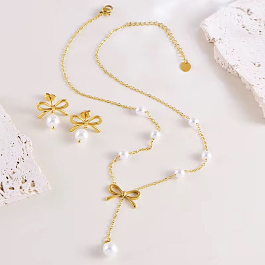 Dangling pearl bow necklace